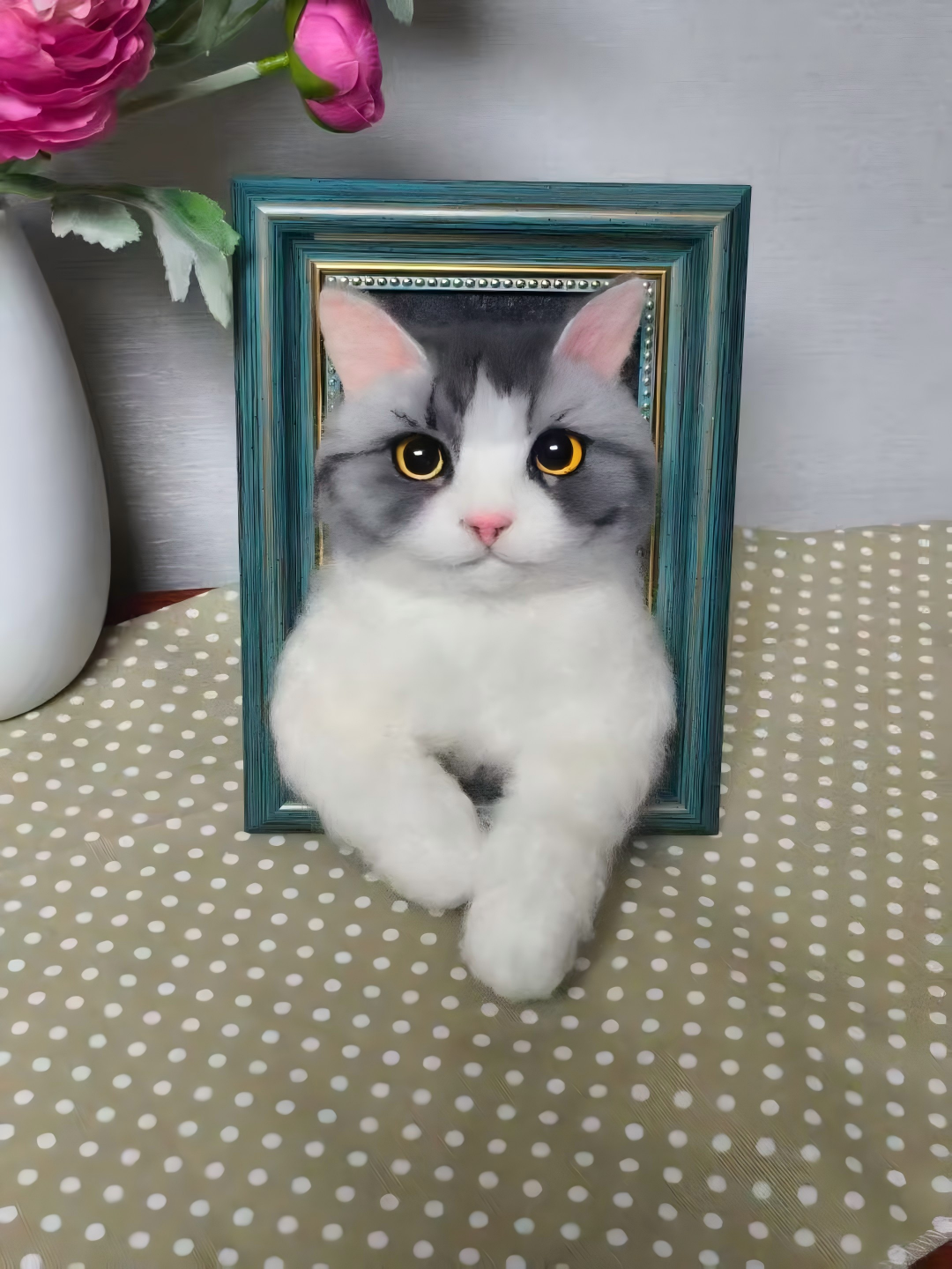 3D framed portrait of a gray-and-white cat with bright yellow eyes, seated