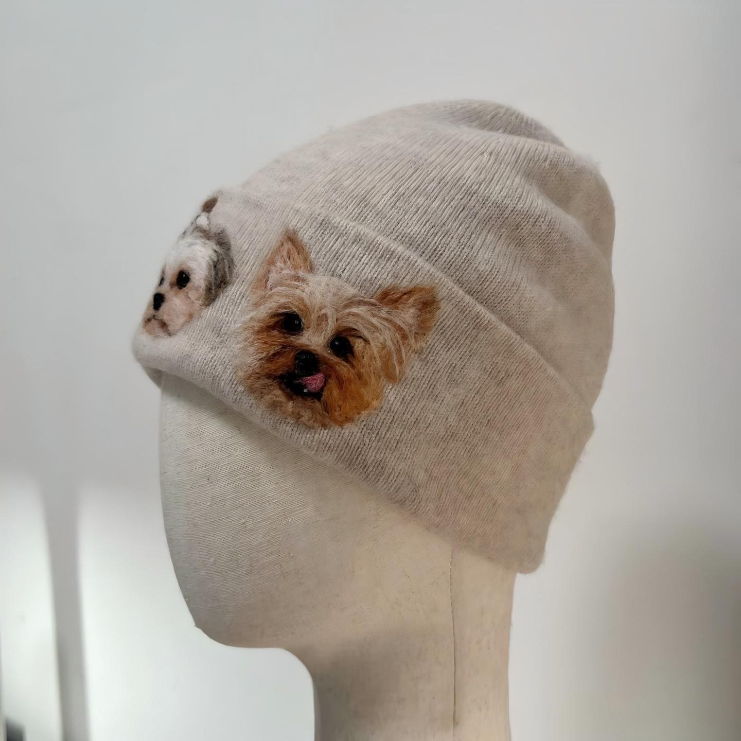Beige knit beanie with terrier face patch on cuff