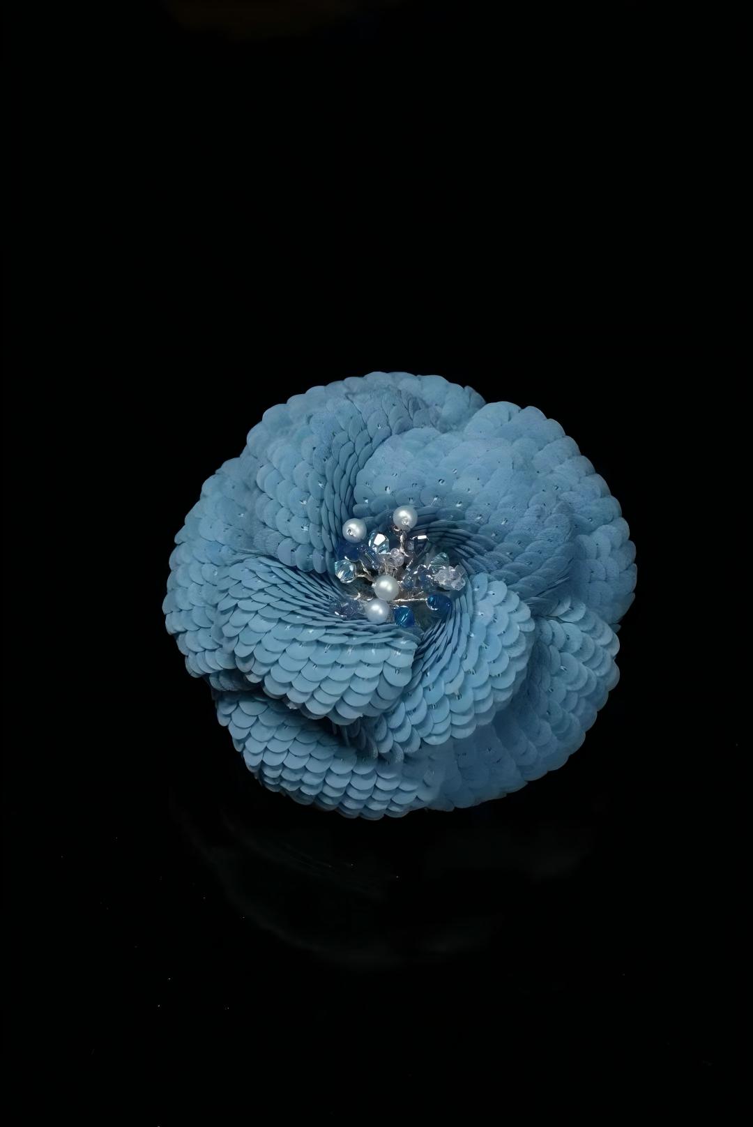 Light blue camellia brooch with sequined petals and pearl centerpiece
