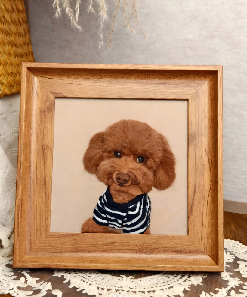 Wood-framed dog portrait, brown poodle wearing navy-and-white striped shirt