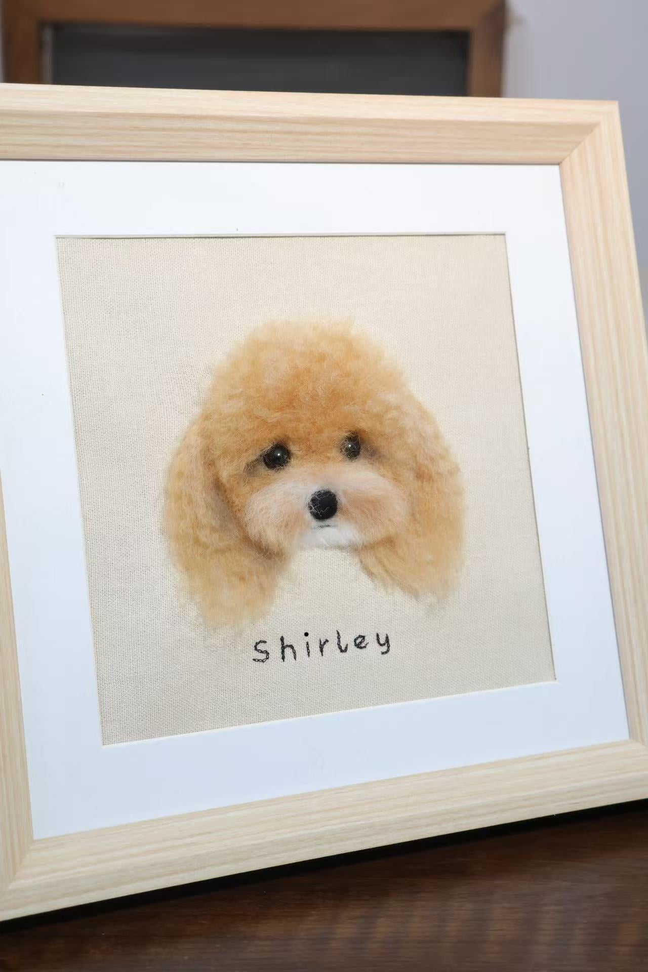 Wood-framed dog portrait, light brown poodle face, 'shirley' text visible