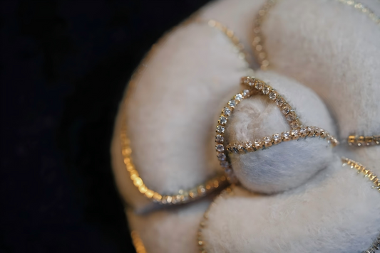 White camellia brooch with gold beaded border and rhinestone-like heart accents
