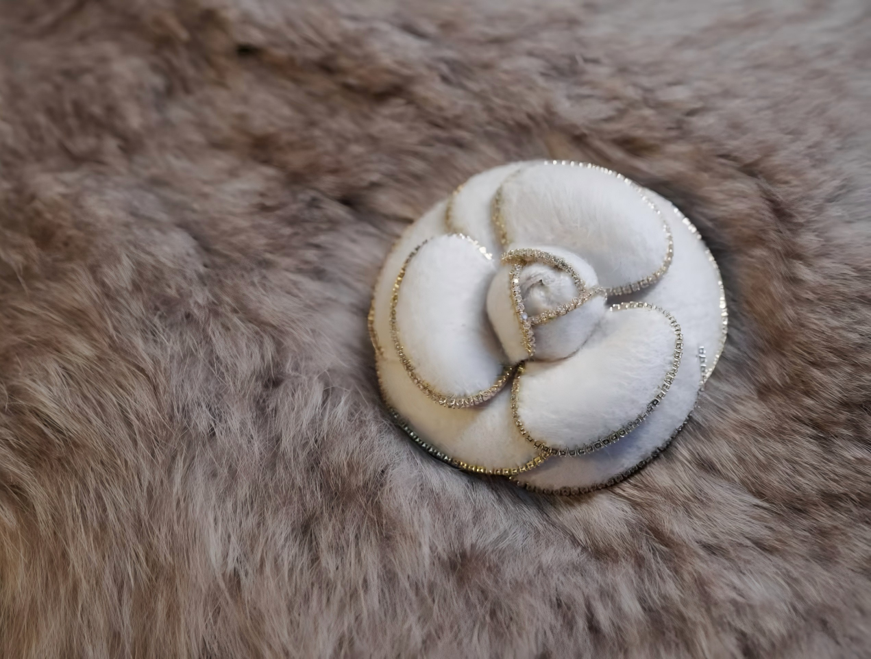 White camellia brooch with gold beaded outline and pearl-like center petals